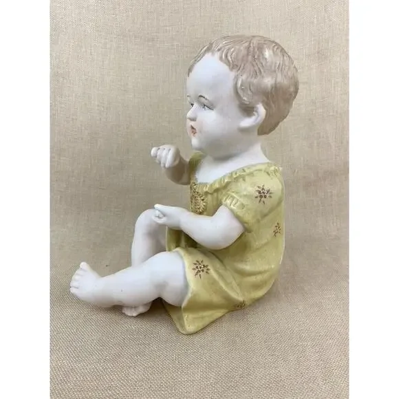 Vintage Bisque Porcelain Piano Baby Figurine 7”